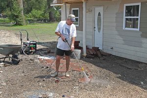 FEMA_-_30619_-_Man_cleaning_sidewalk_in_Missouri_with_pressure_washer